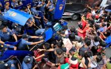 Various activist and Indigenous People's (IP) groups clash with anti-riot policemen during a protest against the continuing presence of U.S. troops in the Philippines in front of the U.S. Embassy in metro Manila.