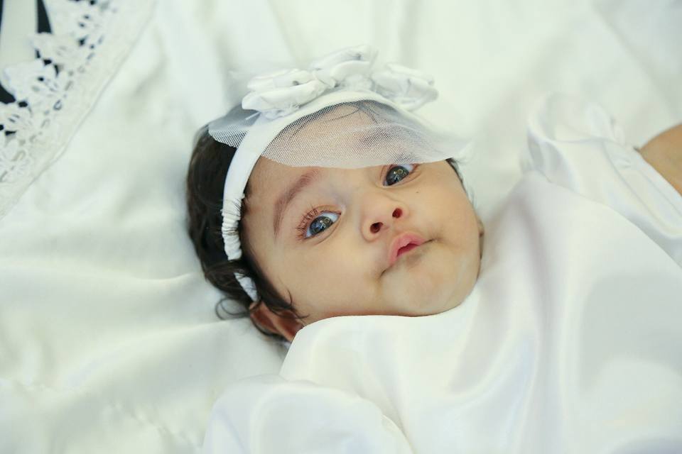 The baby has been named Kiara Rinku Tomy and the actress calls her Kanmani. Muktha,actress Muktha,Muktha daughter,Muktha baby,Muktha baby baptism,rimi tomy,Muktha kids,Muktha daughter kanmani