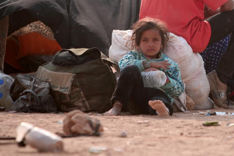 A refugee girl rests, among Iraqi refugees that fled violence in Mosul and internally displaced Syrians whom fled Islamic State controlled areas in Deir al-Zor, near the Iraqi border, in Hasaka Governorate. Iraqis,Islamic State,Mosul,Fleeing one war-torn country to another,refugees,Iraq refugees,Syria,northeastern Syria,Iraqi refugees