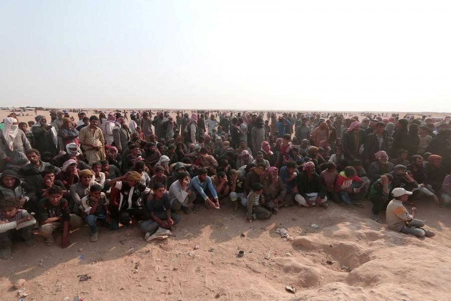 Iraqi refugees that fled violence in Mosul wait to enter Syria Democratic Forces (SDF) controlled land, near the Iraqi border, in Hasaka Governorate. Iraqis,Islamic State,Mosul,Fleeing one war-torn country to another,refugees,Iraq refugees,Syria,northeastern Syria,Iraqi refugees