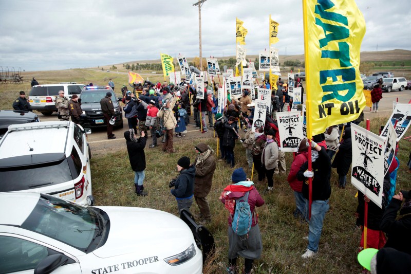 Dakota Access Pipeline protesters square off against police between the Standing Rock Reservation and the pipeline route outside the little town of Saint Anthony, North Dakota. North Dakota pipeline protest,pipeline protest,North Dakota protest,violent clashes,Dakota Access oil pipeline project,Dakota oil pipeline project,Native American