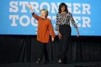 U.S. Democratic presidential candidate Hillary Clinton arrives to a campaign rally accompanied by U.S. first lady Michelle Obama in Winston-Salem, North Carolina, U.S., October 27, 2016.
