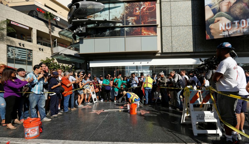 Donald Trump's star on the Hollywood Walk of Fame is fixed. His star on the Walk of Fame was previously targeted. In the summer, a street artist erected a tiny wall around the star, complete with miniature American flags and barbed wire. The art piece, which was later removed, made light of Trump's campaign pledge to build a wall along the U.S. border with Mexico. Donald Trump,Trump's Hollywood star vandalized,Hollywood Walk of Fame,Donald Trump star vandalized,sledgehammer,Hillary Clinton