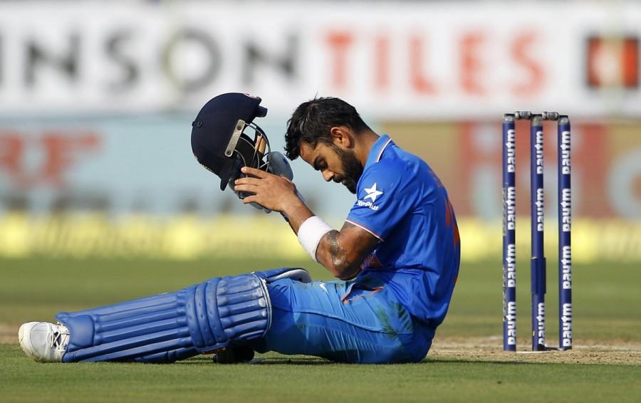 Virat Kohli brings up India's 200-run-mark after scoring his 38th ODI 50. India vs New Zealand,India vs New Zealand 5th ODI,India win toss,India vs New Zealand 5th ODI pics,India vs New Zealand 5th ODI images,India vs New Zealand 5th ODI photos,India vs New Zealand 5th ODI stills,India vs New Zealand 5th ODI pictures