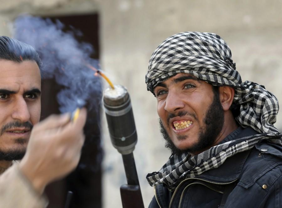 Fighters from the Free Syrian Army's Tahrir al Sham brigade use a shotgun to fire an improvised grenade at Syrian Army soldiers in the Arabeen neighborhood of Damascus. DIY weapons of Syria,Syria DIY weapons,Syrian tanks,Syrian missiles,Syrian mortars,Dahiyat al-Assad