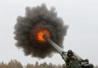 A Ukrainian serviceman fires a 2S7 Pion self-propelled gun during military exercises near the village of Divychky in Kiev region, Ukraine.