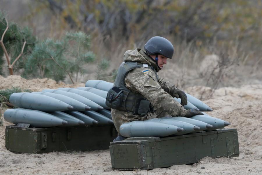 Ukrainian serviceman prepares shells during military exercises near the village of Divychky in Kiev region, Ukraine. Ukraine war games,Ukraine guns during,Ukraine military exercises,Ukraine military exercises pics,Ukraine military exercises images,Ukraine military exercises photos,Ukraine military exercises stills,Ukraine military exercises pictures