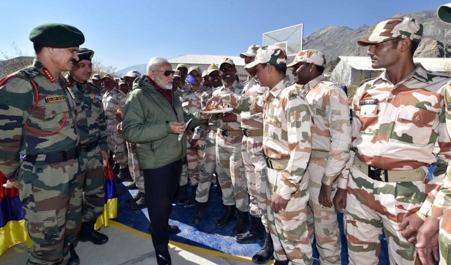 Photos of Prime Minister Narendra Modi interacts with soldiers in a remote and strategic area in Himachal Pradesh, adjoining the Chinese border on Oct 30, 2016. PM Modi,Narendra Modi,Narendra Modi celebrates Diwali,Narendra Modi celebrates Diwali with Indian Army,Narendra Modi with Indian Army,Himachal Pradesh