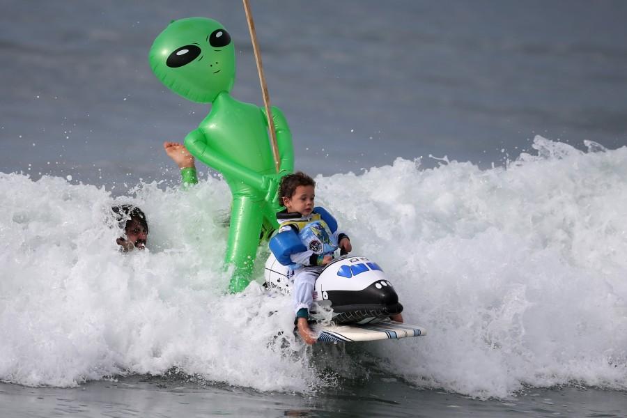 Oliver Quiros, 3, competes dressed as an astronaut in a space shuttle in the Haunted Heats Halloween Surf Contest in Santa Monica, California. Halloween surf contest,Halloween surf contest 2016,Halloween meets surfing,Santa Monica,Haunted Heats Halloween Surf Contest