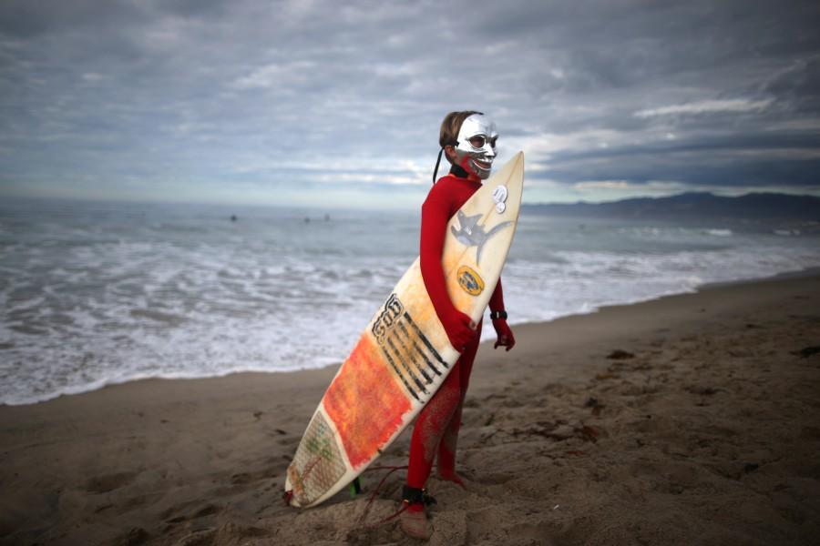 Beau Werger, 12, prepares to compete in the Haunted Heats Halloween Surf Contest in Santa Monica, California. Halloween surf contest,Halloween surf contest 2016,Halloween meets surfing,Santa Monica,Haunted Heats Halloween Surf Contest