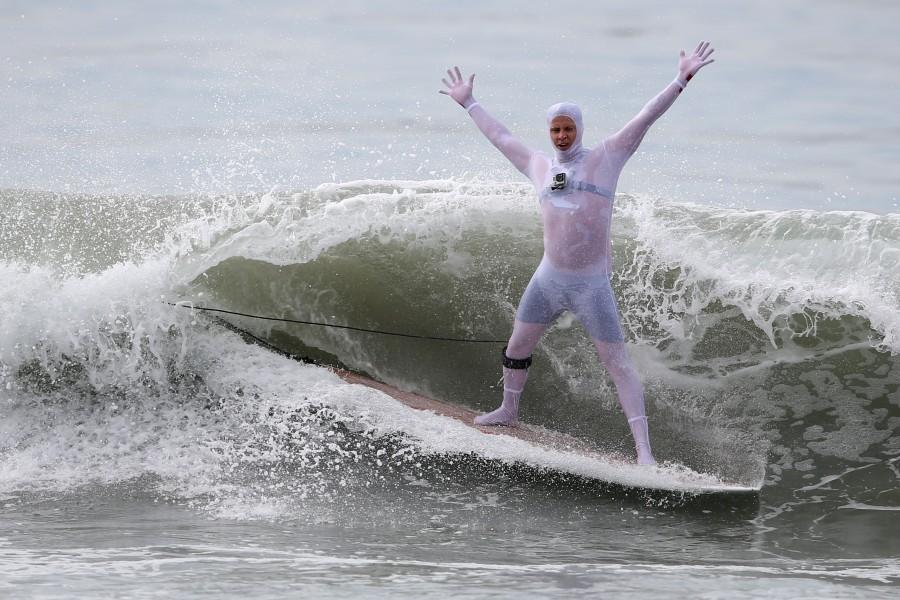 A man competes in the Haunted Heats Halloween Surf Contest in Santa Monica, California. Halloween surf contest,Halloween surf contest 2016,Halloween meets surfing,Santa Monica,Haunted Heats Halloween Surf Contest
