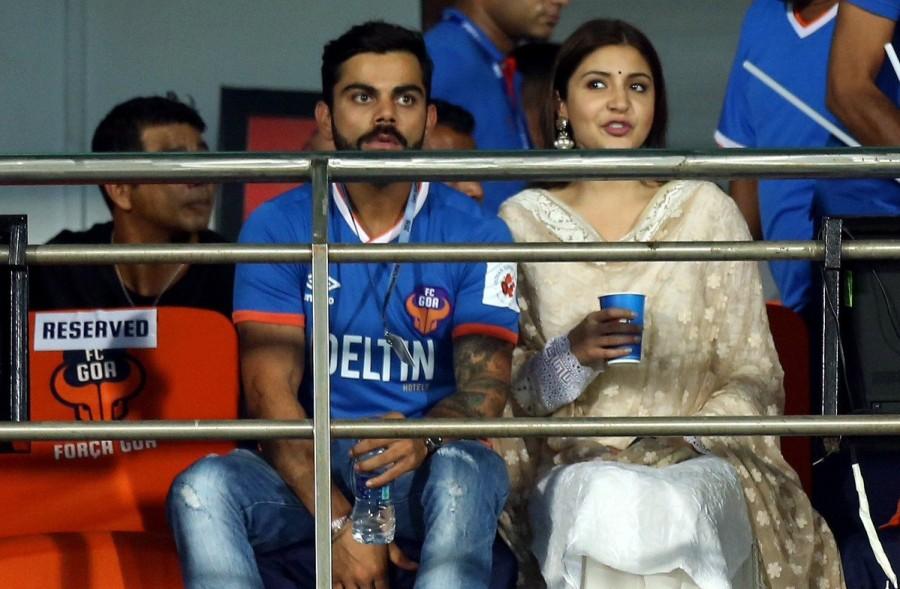 Indian Cricketer Virat Kohli with actress Anushka Sharma during an ISL match between Delhi Dynamos and FC Goa in Goa on Oct 30, 2016. Virat Kohli and Anushka Sharma,Virat Kohli,Anushka Sharma,ISL match,Delhi Dynamos and FC Goa,Delhi Dynamos,FC Goa