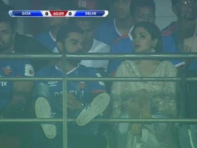 Indian Cricketer Virat Kohli with actress Anushka Sharma during an ISL match between Delhi Dynamos and FC Goa in Goa on Oct 30, 2016. Virat Kohli and Anushka Sharma,Virat Kohli,Anushka Sharma,ISL match,Delhi Dynamos and FC Goa,Delhi Dynamos,FC Goa