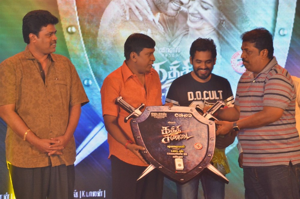 Tamil movie Kaththi Sandai Audio and Trailer Launch event held at Chennai. Celebs like Vishal, Vadivelu, Hiphop Tamizha Aadhi, Suraj, Richard M. Nathan, S. Nanthagopal, Aarthi, Selva RK, Ganesh and others graced the event. Kaththi Sandai,Kaththi Sandai Trailer,Kaththi Sandai Trailer launch,Kaththi Sandai audio launch,Kaththi Sandai music,Vishal,Vadivelu,Hiphop Tamizha Aadhi,Suraj,Richard M. Nathan,S. Nanthagopal,Aarthi,Selva RK,Kaththi Sandai Trailer Launch pics,Kaththi San