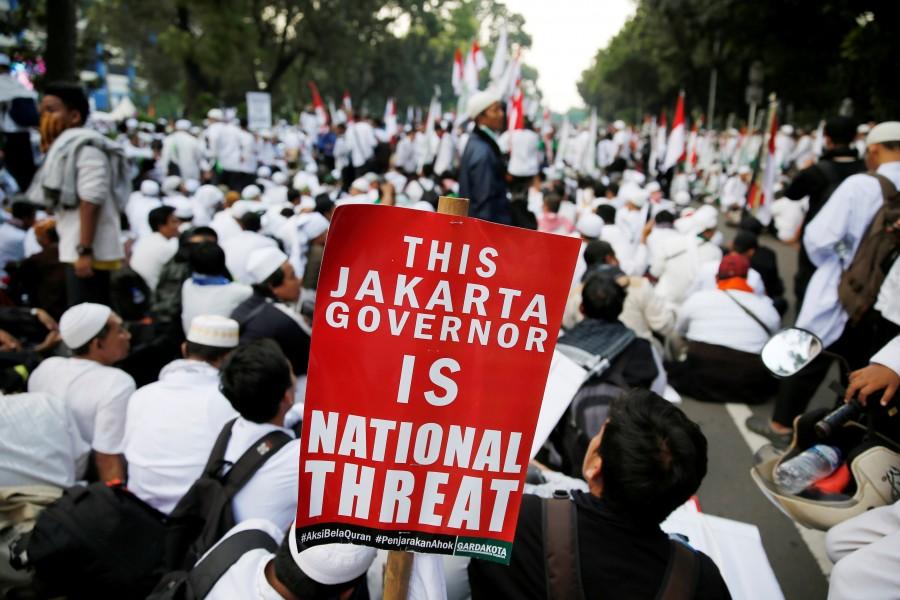 Members of hardline Muslim groups attend a protest against Jakarta's incumbent governor. Indonesia is the world's most populous Muslim country, where many people follow a moderate form of Islam. While hardliners have launched occasional agitation in the past, protests on such a large scale have been rare. Hardline Muslims,massive rally in Indonesia,Muslim protesters,hardline Muslim protesters rally,hardline Muslim protesters,Koran,Islam Love Peace