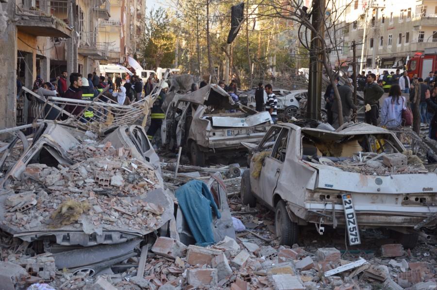 Damaged cars are seen on a street after a blast in Diyarbakir, Turkey. Car bomb,Car bomb explodes after Turkey detains,Car bomb explodes in Turkey,pro-Kurdish lawmakers,Turkey,blast in Diyarbakir,Diyarbakir blast