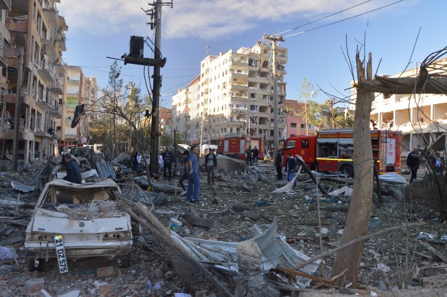 Damaged cars are seen on a street after a blast in Diyarbakir, Turkey. Car bomb,Car bomb explodes after Turkey detains,Car bomb explodes in Turkey,pro-Kurdish lawmakers,Turkey,blast in Diyarbakir,Diyarbakir blast