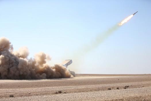 Iraqi security forces launch a rocket towards Islamic State militants during clashes at a frontline in Ali Rash village, southeast of Mosul, Iraq.