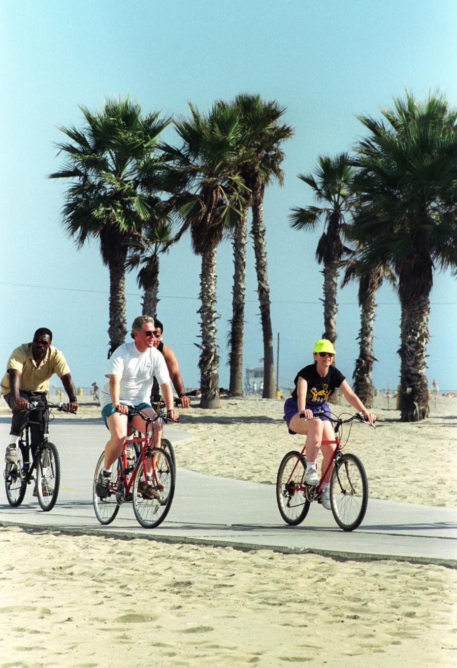 Democratic Presidential candidate Bill Clinton (L) and his wife Hillary pedal bicycles September 16, 1992 along the bike path in Santa Monica, California after a full day of appearances in the Los Angeles area. Clinton will attend a fundraiser Wednesday evening with Hollywood stars which will feature a performance by singer Barbra Streisand. Hillary Clinton,Hillary Clinton rare pics,Hillary Clinton rare images,Hillary Clinton rare photos,Hillary Clinton rare stills,Hillary Clinton rare pictures,Hillary Clinton unseen pics,Hillary Clinton unseen images,Hillary Clinton unseen photos,Hillary Cli