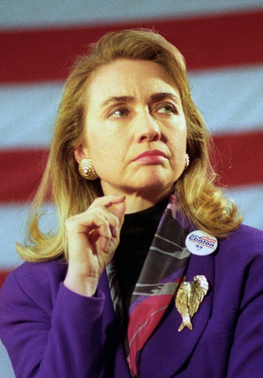 Hillary Clinton listens as her husband Democratic president candidate Bill Clinton addresses students at Wayne Memorial High School on March 16, 1992 in Wayne, MI. Hillary Clinton,Hillary Clinton rare pics,Hillary Clinton rare images,Hillary Clinton rare photos,Hillary Clinton rare stills,Hillary Clinton rare pictures,Hillary Clinton unseen pics,Hillary Clinton unseen images,Hillary Clinton unseen photos,Hillary Cli