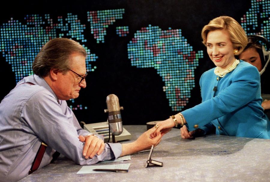 Sporting a new hairdo, first Lady Hillary Rodham Clinton shows her wedding ring to CNN's Larry King, May 5, 1994 in Washington. Behind the first lady is a technician adjusting a microphone. Hillary Clinton,Hillary Clinton rare pics,Hillary Clinton rare images,Hillary Clinton rare photos,Hillary Clinton rare stills,Hillary Clinton rare pictures,Hillary Clinton unseen pics,Hillary Clinton unseen images,Hillary Clinton unseen photos,Hillary Cli