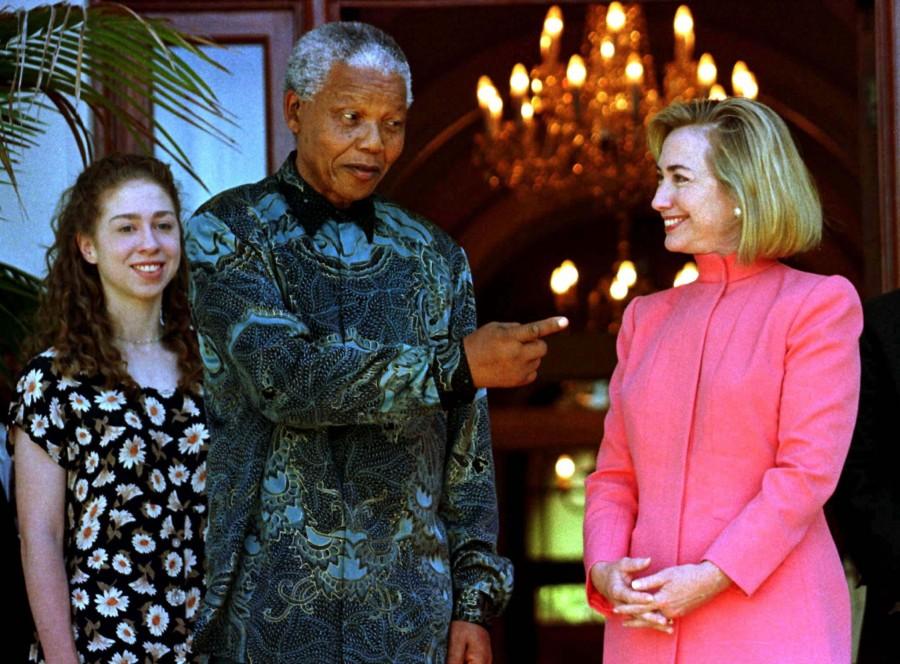 U.S. First Lady Hillary Clinton (R) meets with South African President Nelson Mandela (C) at Mandela's residence in Cape Town March 20, as Mrs. Clinton's daughter Chelsea (L) looks on. Mrs. Clinton is on a six nation tour of the African continent. Hillary Clinton,Hillary Clinton rare pics,Hillary Clinton rare images,Hillary Clinton rare photos,Hillary Clinton rare stills,Hillary Clinton rare pictures,Hillary Clinton unseen pics,Hillary Clinton unseen images,Hillary Clinton unseen photos,Hillary Cli