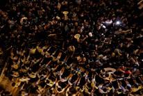 Police stop demonstrators as they protest against what they call Beijing's interference over local politics and the rule of law, a day before China's parliament is expected to announce their interpretation of the Basic Law in light of two pro-independence lawmakers' oath-taking controversy in Hong Kong.