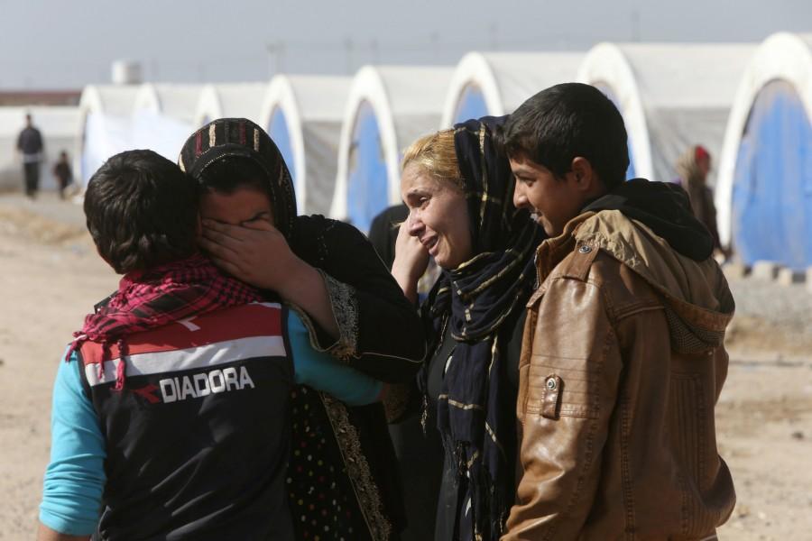 Displaced Iraqi people, who fled the Islamic State stronghold of Mosul, meet their relatives in Khazer refugee camp, east of Mosul, Iraq. Islamic State,Mosul,Mosul meet,Tearful reunions,Tearful reunions after escaping Islamic State,Mosul meet pics
