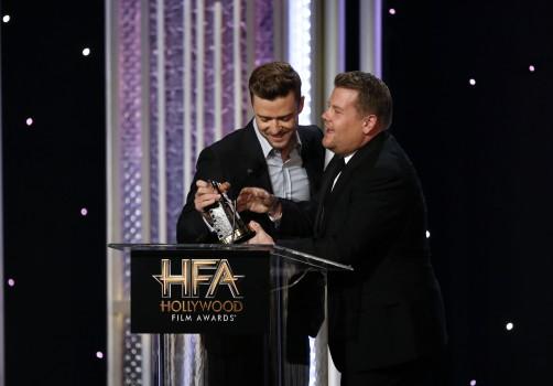 Actor James Corden congratulates musician Justin Timberlake (L) as he accepts the Hollywood Song Award for 