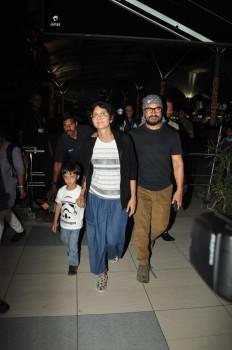 Photos of actor Aamir Khan with his wife Kiran Rao and son Azad Rao Khan spotted while returning from holiday in Mumbai.