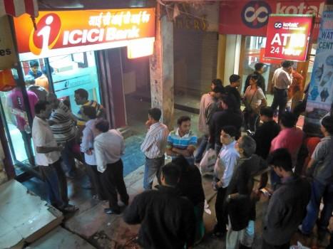 People wait in the queue outside ATM kiosks after Prime Minister Narendra Modi announced demonetisation of Rs 1000 and Rs 500 notes with effect from midnight, making these notes invalid in a major assault on black money, fake currency and corruption in New Delhi on Nov. 8, 2016.