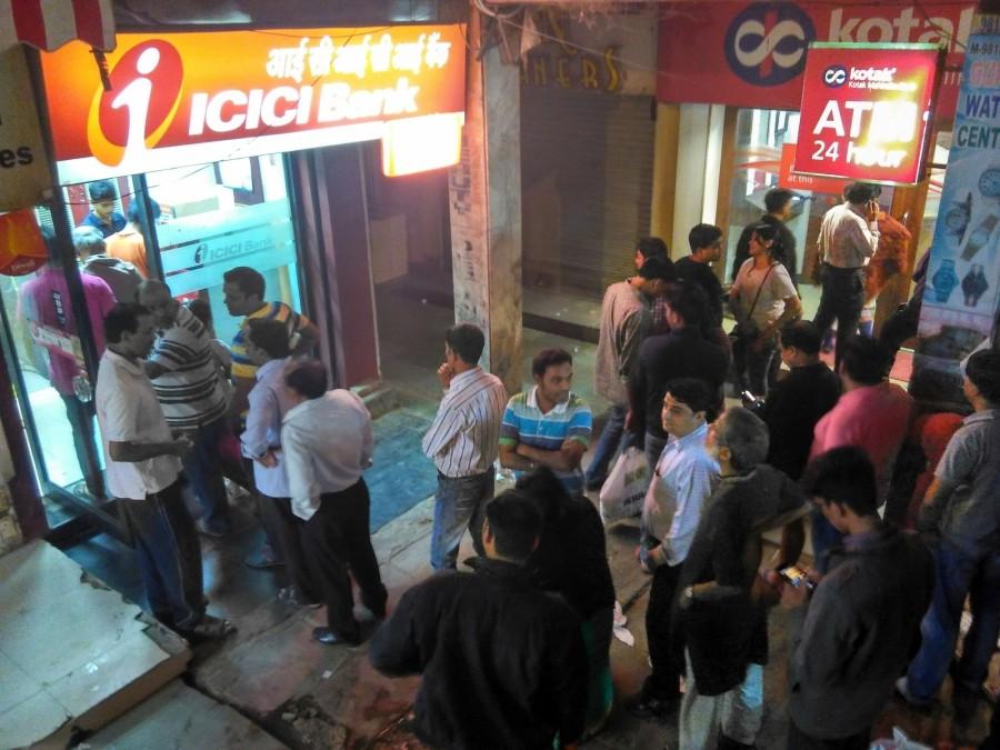 People wait in the queue outside ATM kiosks after Prime Minister Narendra Modi announced demonetisation of Rs 1000 and Rs 500 notes with effect from midnight, making these notes invalid in a major assault on black money, fake currency and corruption in New Delhi on Nov. 8, 2016. Rs 500,Rs 1000,Rs 1000 notes,Rs 1000 notes banned,Long queues at ATMs,Rs 500 notes,ATM kiosks,Prime Minister Narendra Modi,Narendra Modi