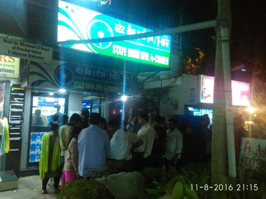 People wait in the queue outside ATM kiosks after Prime Minister Narendra Modi announced demonetisation of Rs 1000 and Rs 500 notes with effect from midnight, making these notes invalid in a major assault on black money, fake currency and corruption in New Delhi on Nov. 8, 2016. Rs 500,Rs 1000,Rs 1000 notes,Rs 1000 notes banned,Long queues at ATMs,Rs 500 notes,ATM kiosks,Prime Minister Narendra Modi,Narendra Modi