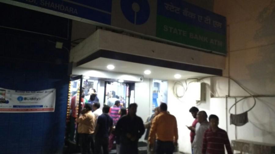 People wait in the queue outside ATM kiosks after Prime Minister Narendra Modi announced demonetisation of Rs 1000 and Rs 500 notes with effect from midnight, making these notes invalid in a major assault on black money, fake currency and corruption in New Delhi on Nov. 8, 2016. Rs 500,Rs 1000,Rs 1000 notes,Rs 1000 notes banned,Long queues at ATMs,Rs 500 notes,ATM kiosks,Prime Minister Narendra Modi,Narendra Modi