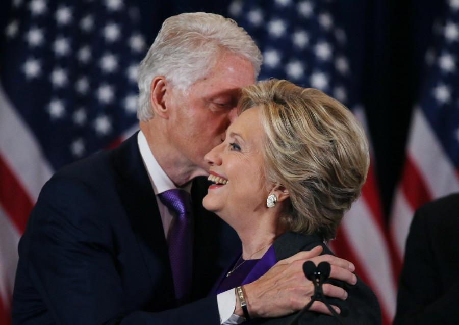 Hillary Clinton is embraced by her husband former U.S. President Bill Clinton (L), as she addresses her staff and supporters about the results of the U.S. election at a hotel in New York, November 9, 2016. Hillary Clinton,Hillary Clinton addresses supporters,Donald Trump,president-elect,president election,White House,US election
