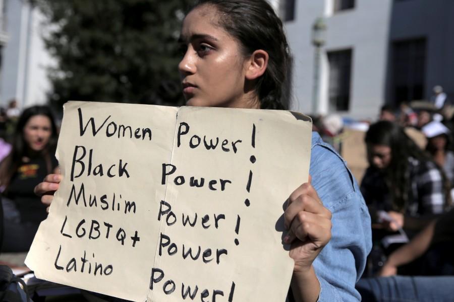 Berkeley High student Ariana Melton, 16, holds a sign during a protest in response to the election of Republican Donald Trump as President of the United States in Berkeley, California, U.S. November 9, 2016. Donald Trump,Donald Trump as 45th US President,45th US President,US President,America divided after the Election,People react after the results,America divided after election