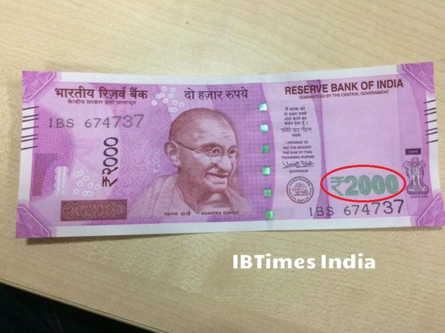 10. Denominational numeral with Rupee Symbol, 2000 in colour changing ink (green to blue) on bottom right. Society,PM Modi,Rs 2000,Photos of rs 2000 notes,New rs 2000 note,Feature,Security,Fake,Corruption,Black money,Currency,Note,Detail,You wanted to know,Reserve Bank of India,RBI
