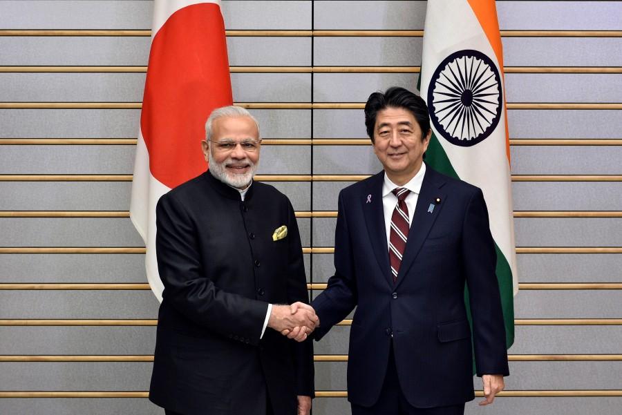 Indian Prime Minister Narendra Modi (L) is shakes hands with Japan's Prime Minister Shinzo Abe at the start of their meeting at Abe's official residence in Tokyo, Japan November 11, 2016. Narendra Modi,Shinzo Abe,annual bilateral summit,India-Japan bilateral summit,India-Japan summit
