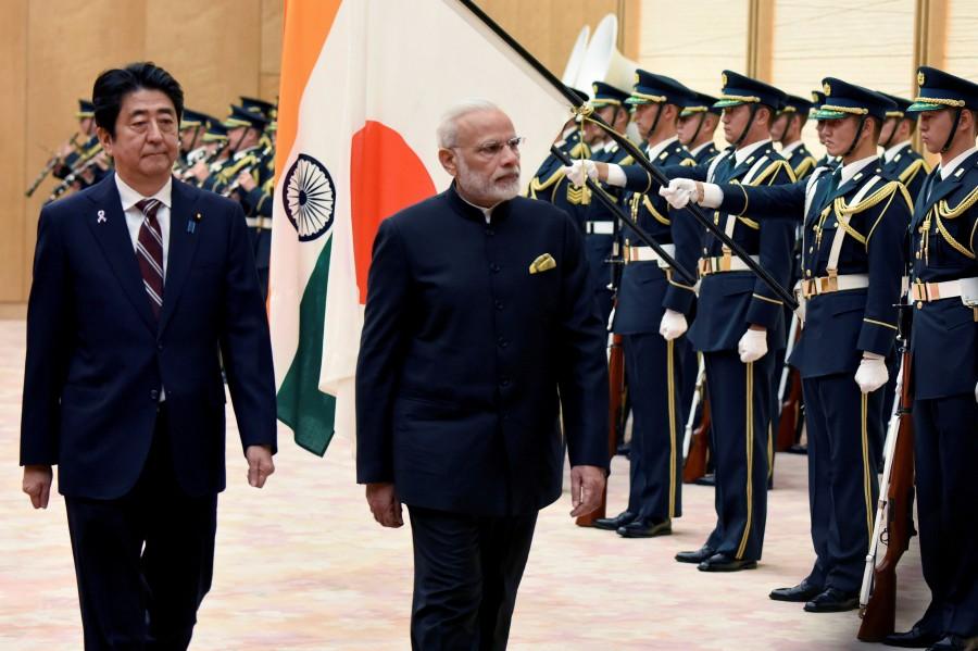 Indian Prime Minister Narendra Modi (2nd L) and his Japanese counterpart Shinzo Abe (L) review an honor guard before their meeting at Abe's official residence in Tokyo, Japan November 11, 2016. Narendra Modi,Shinzo Abe,annual bilateral summit,India-Japan bilateral summit,India-Japan summit