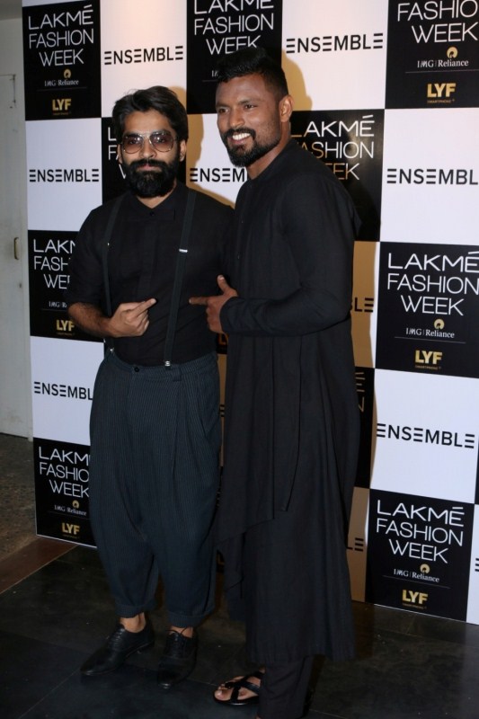 Fashion designer Ujjawal Dubey (L) and Jaipur Pink Panthers kabaddi player Shabeer Bapu Sharfudheen during the Fashion Meets Sports event in Mumbai, on Nov 10, 2016. In celebration of the Kabaddi World Cup win by the Indian Kabaddi team, Lakme Fashion Week hosted the event showcased by select menswear designers, at the multi-designer Ensemble retail store. Lakme Fashion Week,Kabaddi World Cup win,India's Kabaddi World Cup win,Shabeer Bapu Sharfudheen,Vishal P Mane,Rishank Devadiga,Surender Nada,Mohit Chhillar