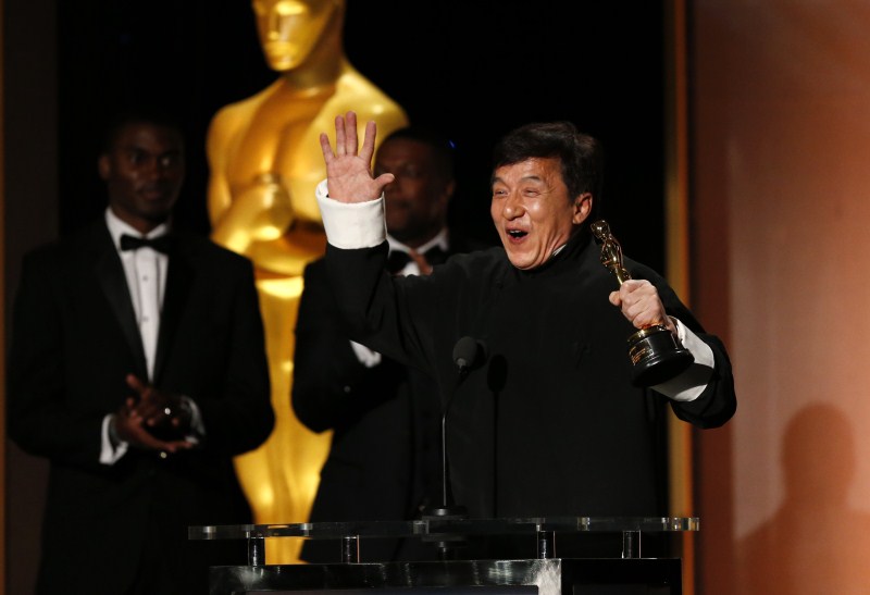 Actor Jackie Chan reacts as he accepts his Honorary Award as actor Chris Tucker (C) looks on at the 8th Annual Governors Awards in Los Angeles, California, U.S., November 12, 2016. Jackie Chan,Jackie Chan wins Oscar,Jackie Chan with Oscar,actor Jackie Chan,Jackie Chan Oscar,Jackie Chan at 8th Annual Governors Awards,8th Annual Governors Awards,8th Annual Governors Awards 2016