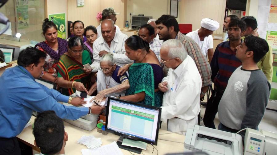 Wearing a white cotton sari, Heerabaa, in her 90s, reached the bank a week after Modi spiked all 500 and 1,000 rupee notes. She later showed a new 2,000 rupee note to journalists. Narendra Modi,Narendra Modi mother,Narendra Modi mother Heeraben Modi,Heeraben Modi,Heeraben Modi visits bank,exchange currency