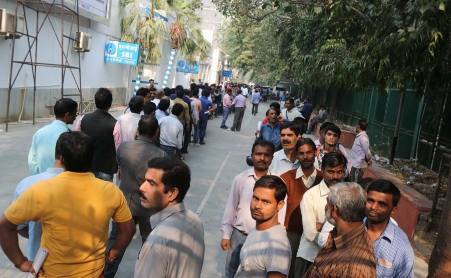 People are turning restless, as their wait in the serpentine queues to deposit, exchange or withdraw money from banks and ATMs since the scrapping of high-value currency notes is turning out to be really long. ATM kiosks,People queue,People queue outside ATM,India queue up outside banks,Demonetisation,No end to long queues,Cash crunch