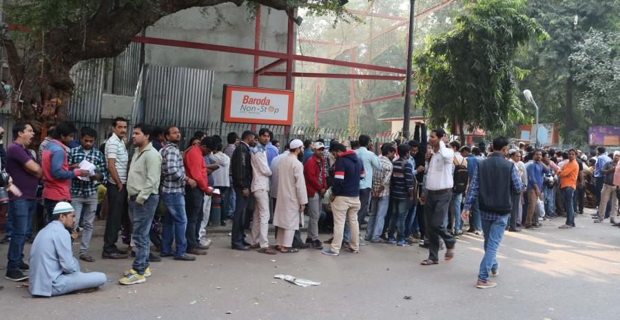 People are turning restless, as their wait in the serpentine queues to deposit, exchange or withdraw money from banks and ATMs since the scrapping of high-value currency notes is turning out to be really long. ATM kiosks,People queue,People queue outside ATM,India queue up outside banks,Demonetisation,No end to long queues,Cash crunch