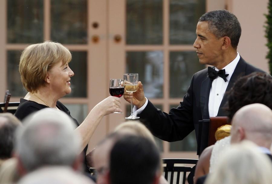 President Barack Obama toasts Chancellor Angela Merkel at an official State Dinner in the Rose Garden at the White House. Barack Obama,President Barack Obama,Obama,German Chancellor Angela Merkel,Angela Merkel,Barack Obama and Angela Merkel,Obama and Angela Merkel