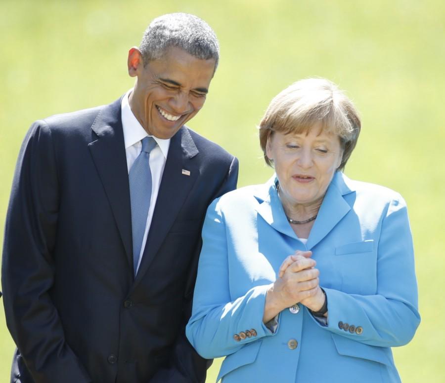 President Barack Obama and Chancellor Angela Merkel prepare for a family photo during their meeting at the hotel castle Elmau in Kruen, Germany. Barack Obama,President Barack Obama,Obama,German Chancellor Angela Merkel,Angela Merkel,Barack Obama and Angela Merkel,Obama and Angela Merkel
