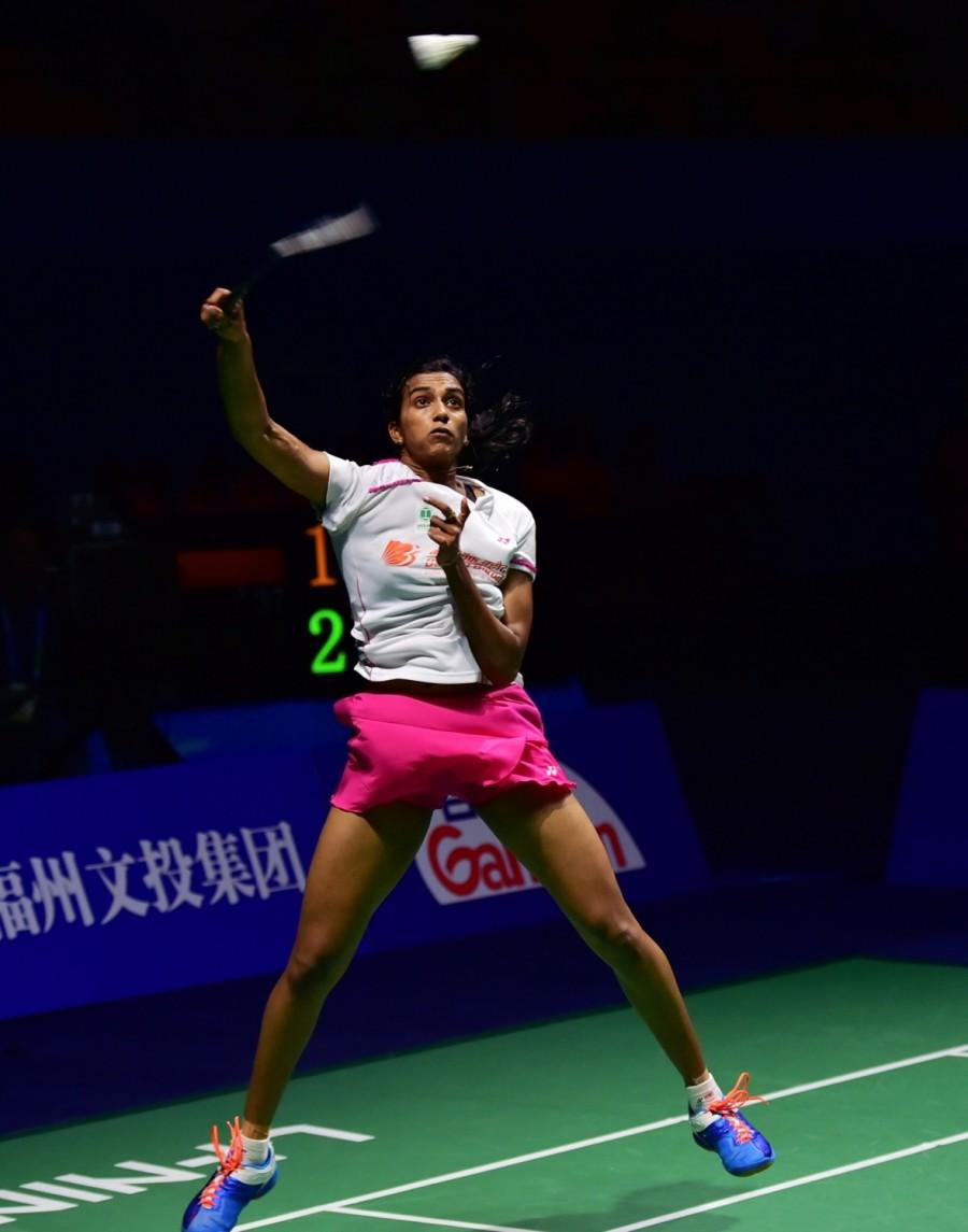 Pusarl Venkata Sindhu of India celebrates during the women's singles final against Sun Yu of China at the China Open badminton tournament in Fuzhou, capital of southeast China's Fujian Province, Nov. 20. Sindhu claimed the title with 2-1. China Open Super Series title,China Open Super Series,PV Sindhu,PV Sindhu wins maiden title,Sun Yu,China Open badminton tournament,Pusarl Venkata Sindhu