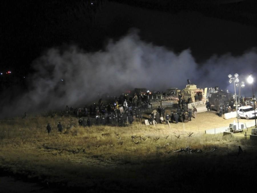 Law enforcement officers surround demonstrators protesting against plans to pass the Dakota Access pipeline during a standoff at the Backwater Bridge in Morton County, North Dakota, U.S., November 20, 2016. North Dakota,North Dakota pipeline protest,Dakota Access oil pipeline project,Native American tribe,Native American