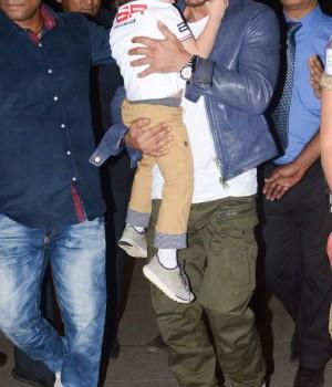 Photos of Bollywood actor Shahrukh Khan snapped with Abram at Mumbai Airport.