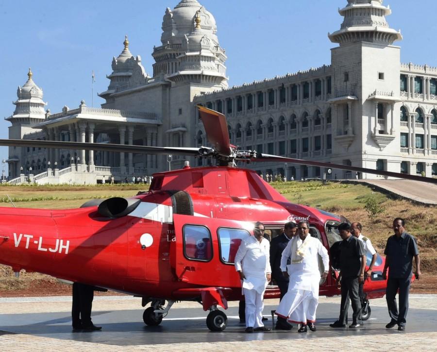 Photos of Karnataka Chief Minister Siddaramaiah arrives from a helicopter, after a new helipad constructed at Suvarna Soudha in Belagavi, for the winter session of the Karnataka Assembly on Nov 22, 2016. Siddaramaiah,CM Siddaramaiah,CM Siddaramaiah arrives at Suvarna Soudha by helicopter,Siddaramaiah arrives at Suvarna Soudha by helicopter,CM Siddaramaiah arrives at Suvarna Soudha